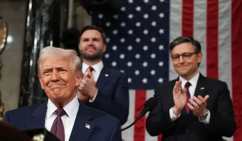 US Speaker of the House Mike Johnson (R-LA) and Vice President JD Vance applaud as US President Donald Trump arrives to address a joint session of Congress at the US Capitol in Washington, DC, on March 4, 2025. (Photo by Win McNamee / POOL / AFP) (Photo by WIN MCNAMEE/POOL/AFP via Getty Images)