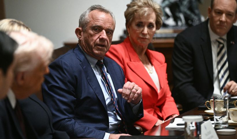 US Secretary of Health and Human Services Robert F. Kennedy Jr. (C) speaks as US President Donald Trump hosts (L) hosts a cabinet meeting in the Cabinet Room of the White House on March 24, 2025, in Washington, DC. Also pictured, US Secretary of Education Linda McMahon (2nd R) and EPA Administrator Lee Zeldin (R). (Photo by Brendan SMIALOWSKI / AFP) (Photo by BRENDAN SMIALOWSKI/AFP via Getty Images)
