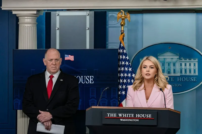 White House Press Secretary Karoline Leavitt (R) speaks as White House with Border Czar Tom Homan (L) looks on during the daily briefing in the Brady Briefing Room of the White House in Washington, D.C. on April 28, 2025. (Photo by Andrew Thomas / Middle East Images / Middle East Images via AFP) (Photo by ANDREW THOMAS/Middle East Images/AFP via Getty Images)