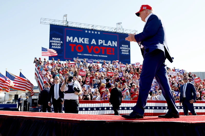 WILMINGTON, NORTH CAROLINA - SEPTEMBER 21: Republican presidential candidate former U.S. President Donald Trump walks offstage after speaking at a campaign rally at the Aero Center Wilmington on September 21, 2024 in Wilmington, North Carolina. Trump is returning to Wilmington, North Carolina after his previous scheduled rally in April was canceled because of a thunderstorm. (Photo by Anna Moneymaker/Getty Images)