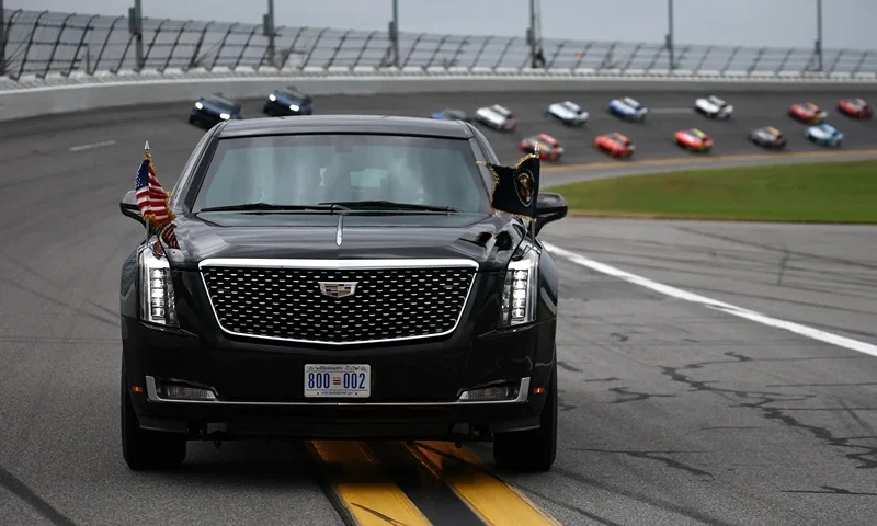 US President Donald Trump is driven around the track prior to the NASCAR Cup Series Daytona 500 at Daytona International Speedway on February 16, 2025 in Daytona Beach, Florida. (Photo by Chris Graythen / POOL / AFP) (Photo by CHRIS GRAYTHEN/POOL/AFP via Getty Images)