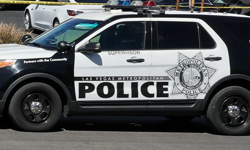 Investigators look over the scene at a Tesla Collision Center after an individual used incendiary devices to set several vehicles on fire on March 18, 2025 in Las Vegas, Nevada. The Las Vegas Metropolitan Police Department said that five Teslas were damaged and believe that the suspect fired three rounds from a firearm at the vehicles and spray painted the word "RESIST" on the entrance. (Photo by Ethan Miller/Getty Images)