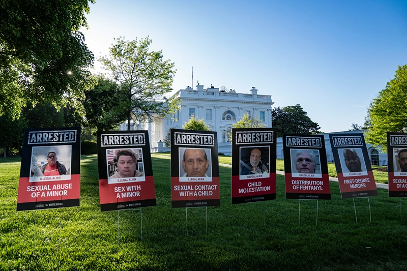 Photos of the criminals who have been captured and had entered the United States illegally are put in the West Wing of the White House on April 28, 2025 in Washington, D.C. (Photo by Andrew Thomas / Middle East Images / Middle East Images via AFP) (Photo by ANDREW THOMAS/Middle East Images/AFP via Getty Images)