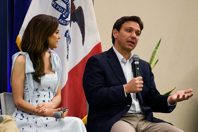 CEDAR RAPIDS, IOWA - MAY 13: Florida Gov. Ron DeSantis (R) speaks onstage with his wife, Casey DeSantis (C) during an Iowa GOP reception on May 13, 2023 in Cedar Rapids, Iowa. Although he has not yet announced his candidacy, Gov. DeSantis has received the endorsement of 37 Iowa lawmakers for the Republican presidential nomination next year. (Photo by Stephen Maturen/Getty Images)