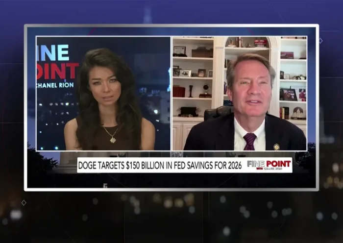 Video still from Fine Point on One America News Network showing a split screen of the host on the left side, and on the right side is the guest, Tim Burchett.