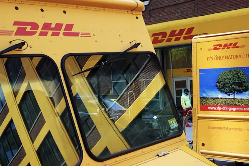 Trucks are parked outside a DHL delivery facility in Manhattan, New York City, U.S., May 9, 2022. REUTERS/Andrew Kelly